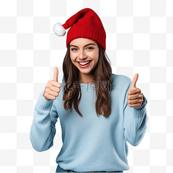 大拇指向上图片_戴着圣诞帽的女孩在孤立的蓝墙上