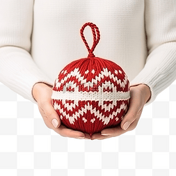 球衣服图片_戴着针织手套的女性手中的圣诞球