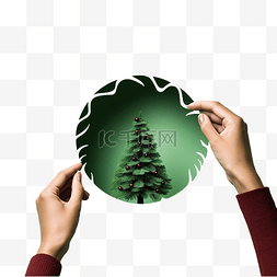 紙孔图片_女手拿着绿纸圆孔中的小创意圣诞