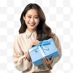 快乐的亚洲年轻夫妇拿着圣诞礼盒