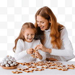 母女做饭图片_母女准备圣诞姜饼并装饰它以度过