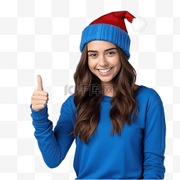 拇指向上图片_戴着圣诞帽戴着孤立蓝色的女孩竖