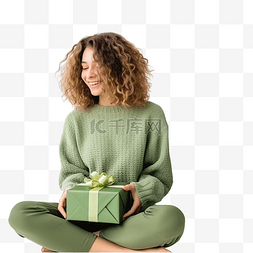礼盒礼盒k图片_圣诞树上，一个穿着针织毛衣的女