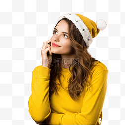 女孩的笑脸图片_戴着圣诞帽的女孩在孤立的黄墙上
