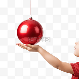 宝宝的手伸向圣诞树上的红色圣诞
