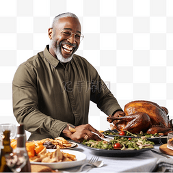 快乐用餐图片_感恩节午餐时，快乐的黑人父亲在