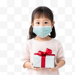 圣诞节，亚洲小女孩拿着一个戴着