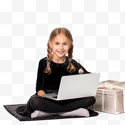 坐着的的孩子图片_圣诞树附近地板上坐着笔记本电脑