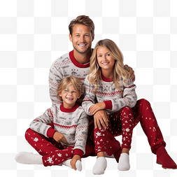 爸爸妈妈抱宝宝图片_穿着漂亮毛衣的一家人坐在圣诞树