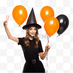 年轻女巫拿着黑色和橙色气球参加