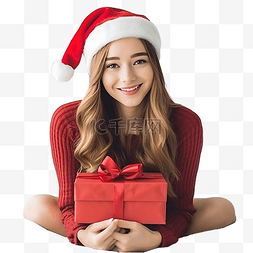 抱着礼盒的女孩图片_戴着红色圣诞帽扎着辫子的女孩坐