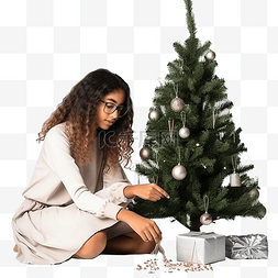 戴眼镜眼镜模特图片_戴眼镜的印度女孩坐着装饰圣诞树