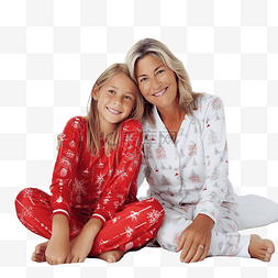 穿着传统圣诞睡衣的祖母和孙女坐