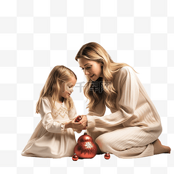 圣诞图片_母亲和女儿在圣诞树旁拿着圣诞玩