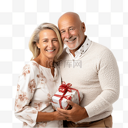 拿女性图片_成熟快乐的夫妇拿着礼物盒在圣诞