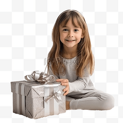 房间里的孩子图片_小女孩坐在圣诞树旁，手里拿着礼