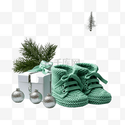 明亮图片_圣诞节新生儿的绿色靴子，配有蜡