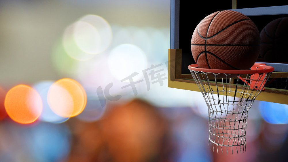 进入篮筐的篮球在五颜六色的体育场光背景美丽的bokeh。体育和竞技游戏概念。3D插图。图片