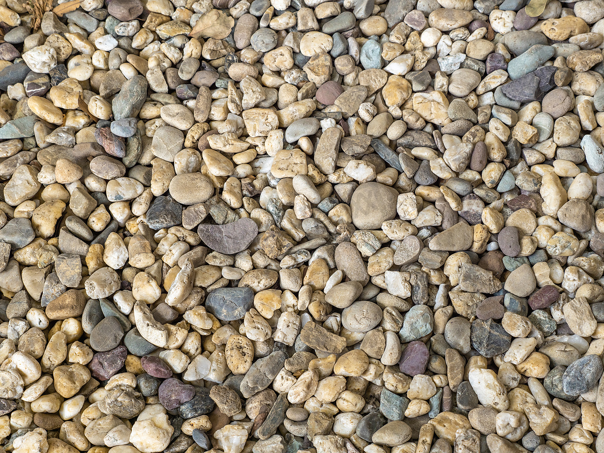 花园中棕色鹅卵石石路地板自然和抽象背景图片