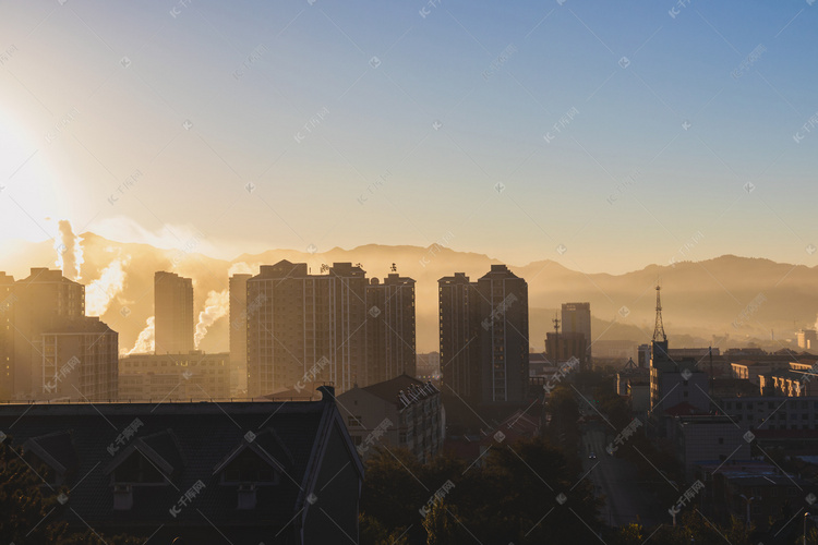 清晨日出中小镇高楼摄影图