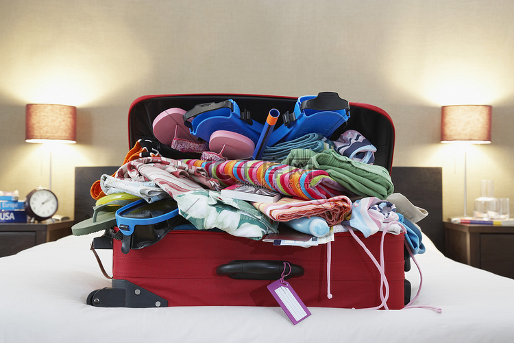 Open suitcase on bed