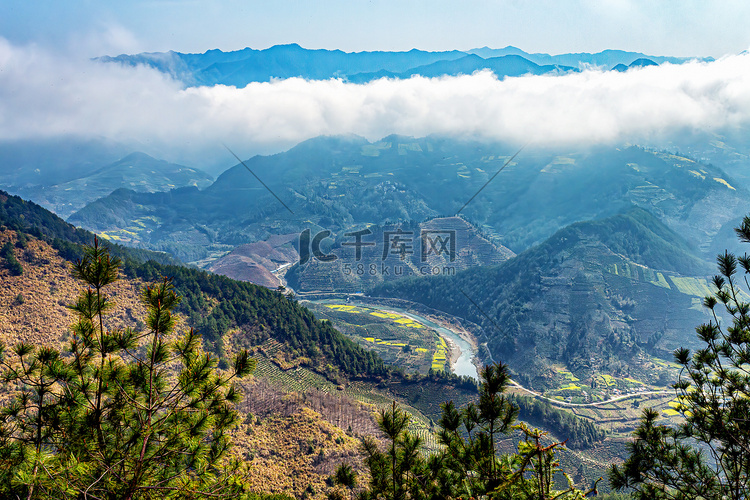 春季上午油菜花山区摇动摄影图配