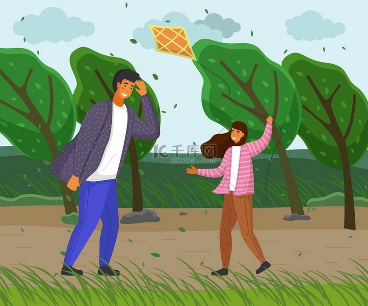 父亲和女儿在公园里玩风筝。