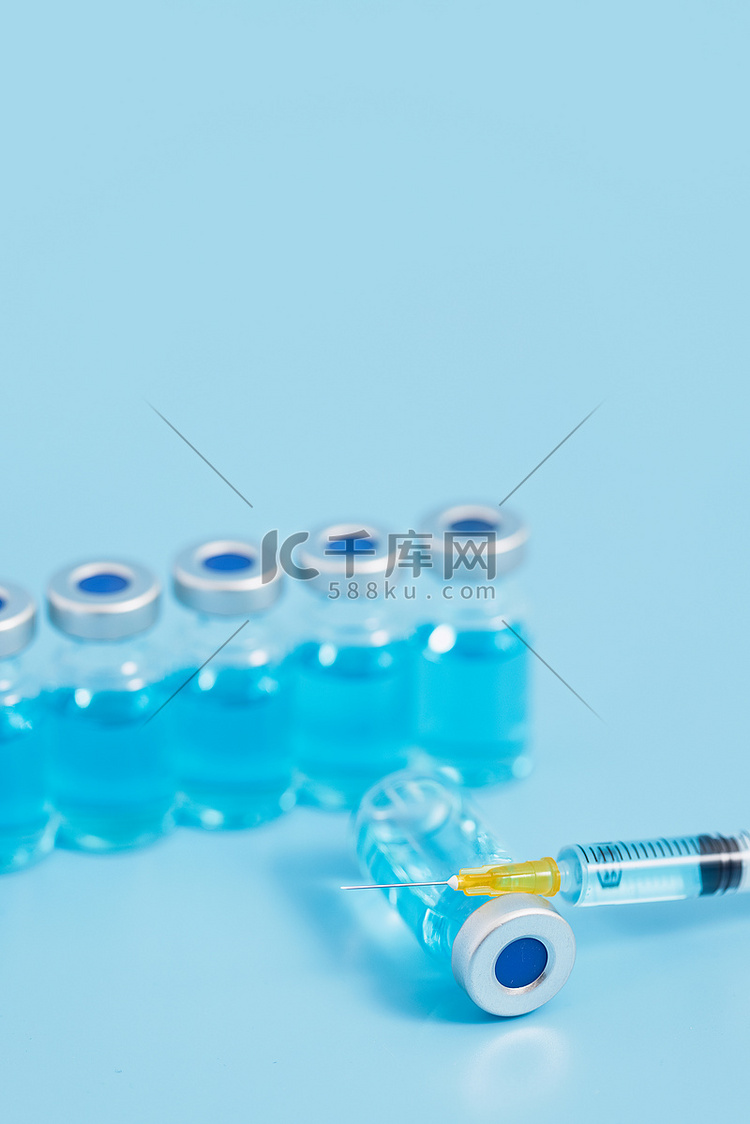 疫苗医疗创意医用蓝色背景摄影图