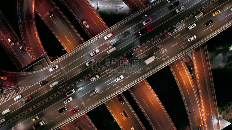 航拍城市高架桥夜间行驶的车流交
