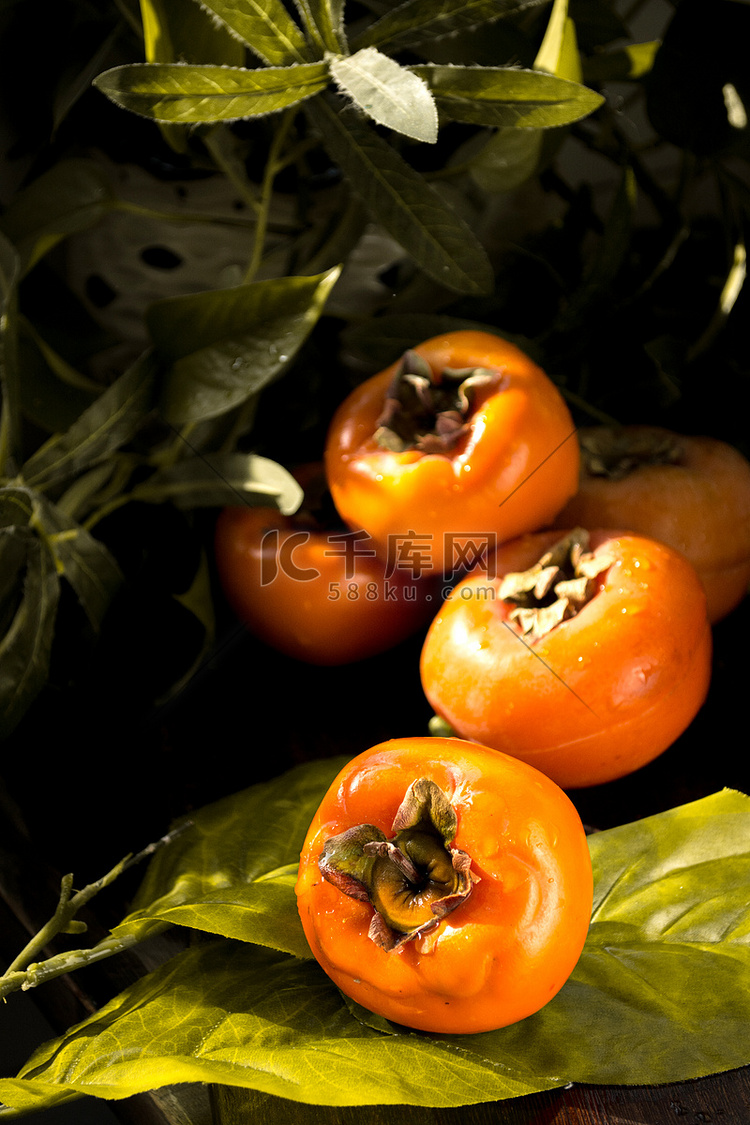 秋天美食柿子摄影图