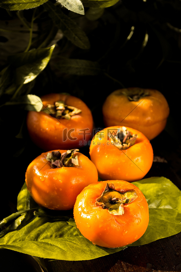 秋天美食柿子摄影图