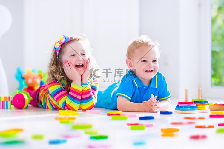 Cjildren playing with wooden toys