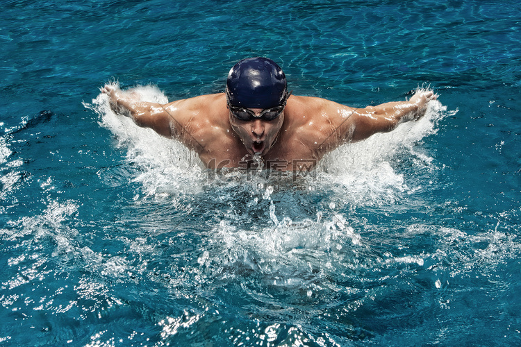 Portrait of young man swimming in pool