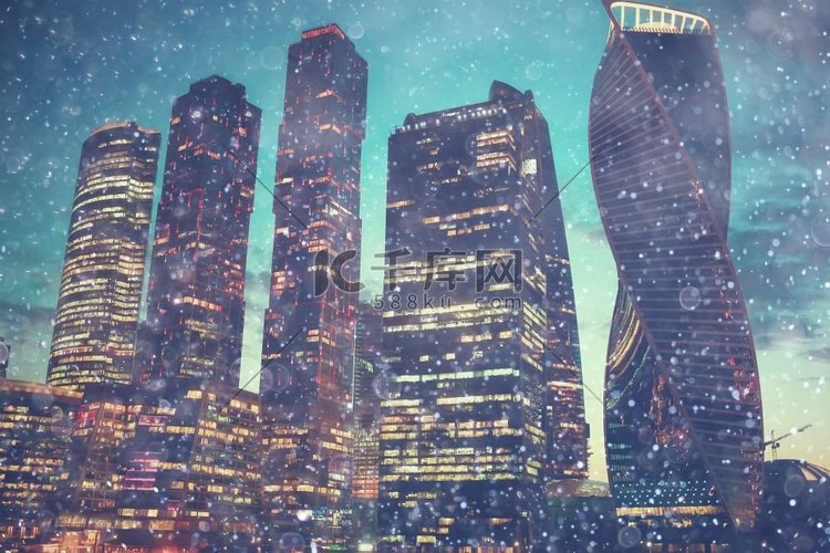 雪在夜城市摩天大楼/季节性风景