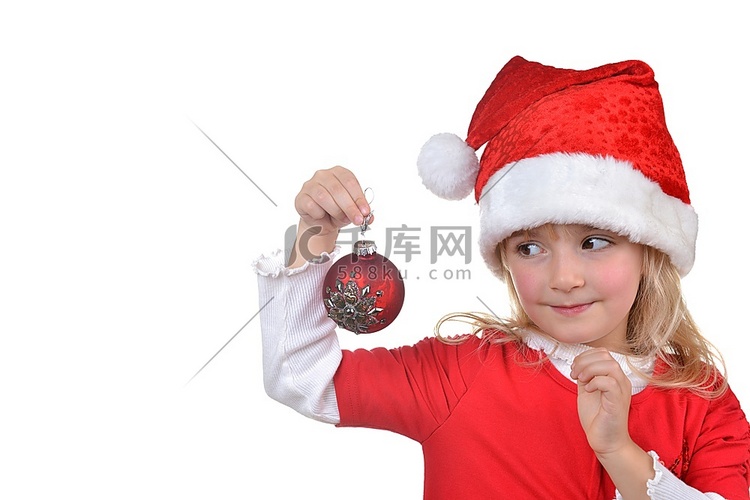 戴着圣诞帽的孩子手里拿着圣诞装