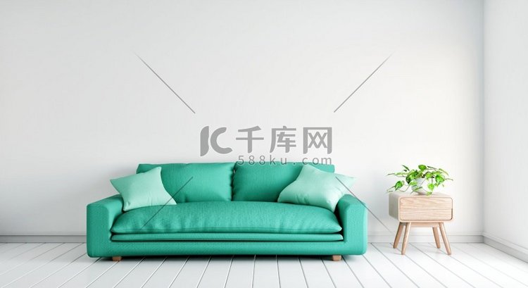 绿色沙发与植物桌子在空的白色墙