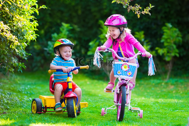 Two children riding bikes
