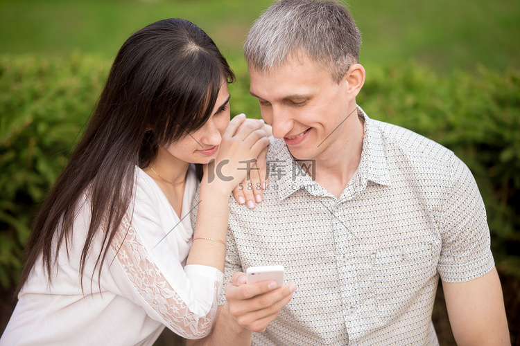 Couple playing with phone