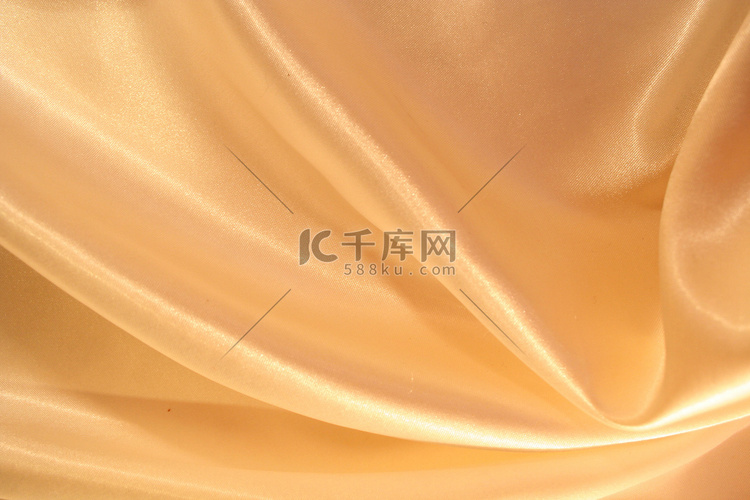 作为背景的光滑优雅的金色丝绸