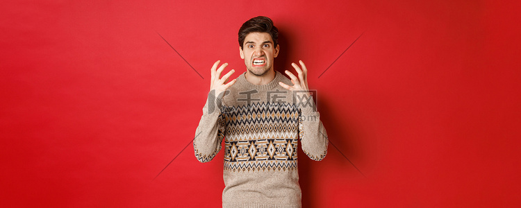 身穿冬季毛衣的愤怒而沮丧的男人