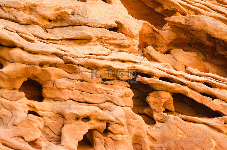 彩色峡谷中橙色石岩的纹理特写