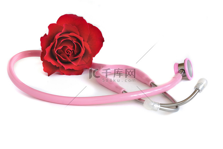 一个粉红色的听诊器和一朵红玫瑰