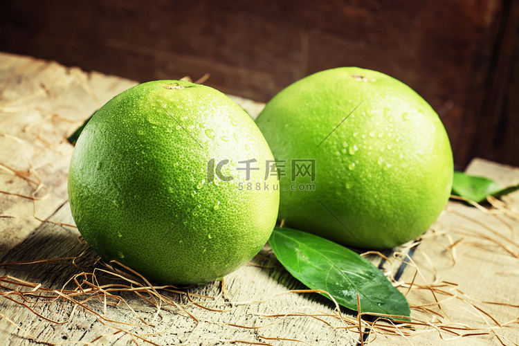 Pomelo fruit on the old wooden table