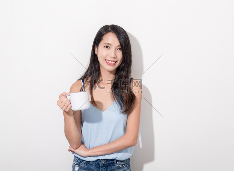 Woman holding a cup of coffee