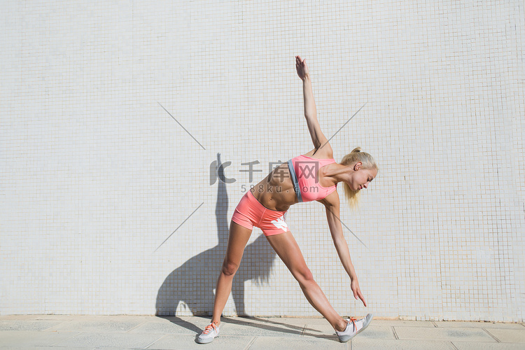 Sportswoman doing physical exercise outdoors