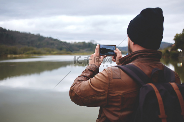 guy taking photo with smart mobile