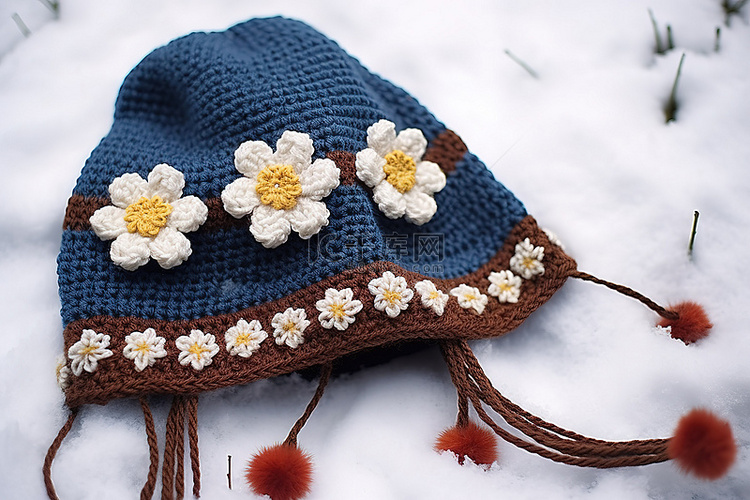 蓝色围巾上有小黄花的雪帽子