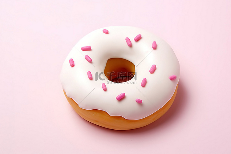 带有粉红色糖霜的白色甜甜圈的图