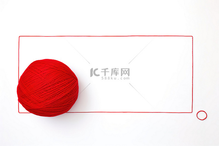 白色画布上的红色毛线球被包围