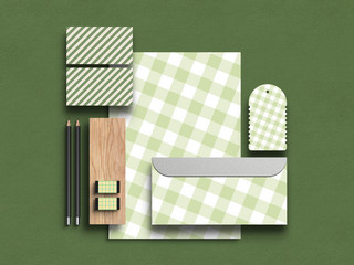 牌桌背景绿色海报模板_企业商务办公文具A4纸张信封吊牌绿色格子条纹图样机